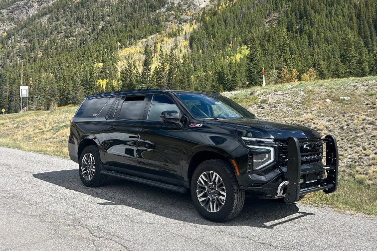 black suv suburban chevy powderhound 888-248-7772