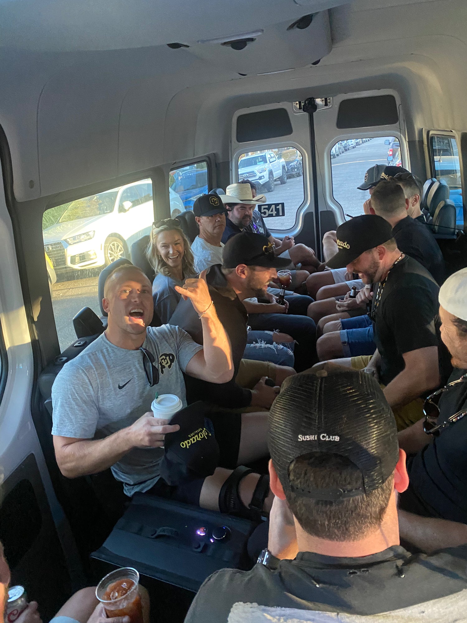 Group of people inside a shuttle going to boulder, co 888-248-7772